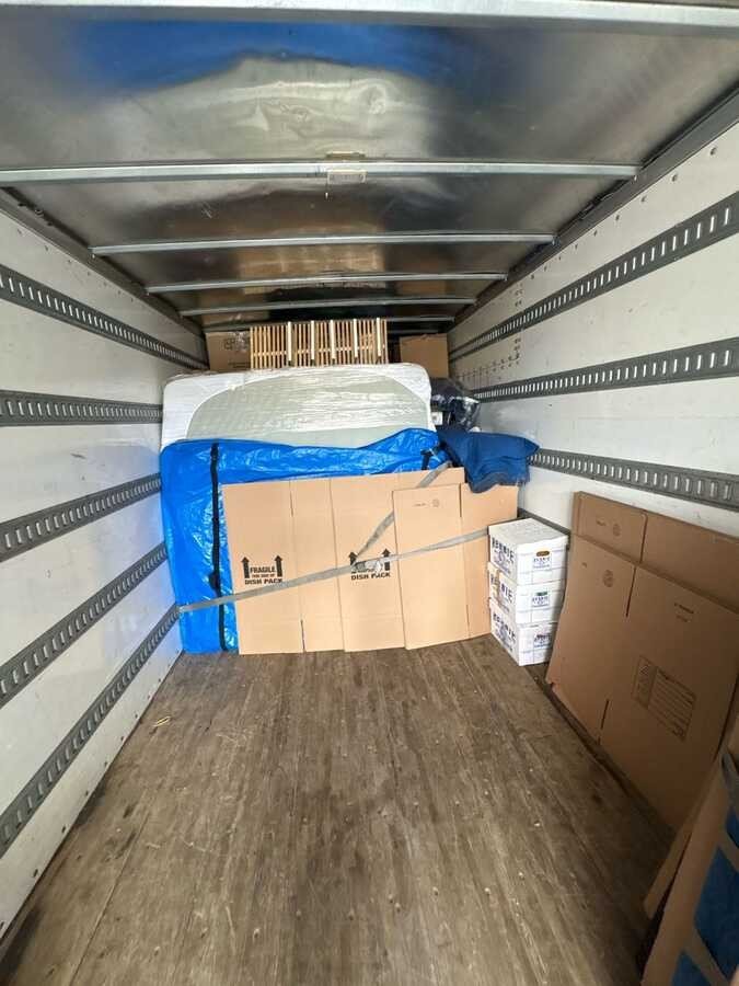 Boxes and household items inside a truck